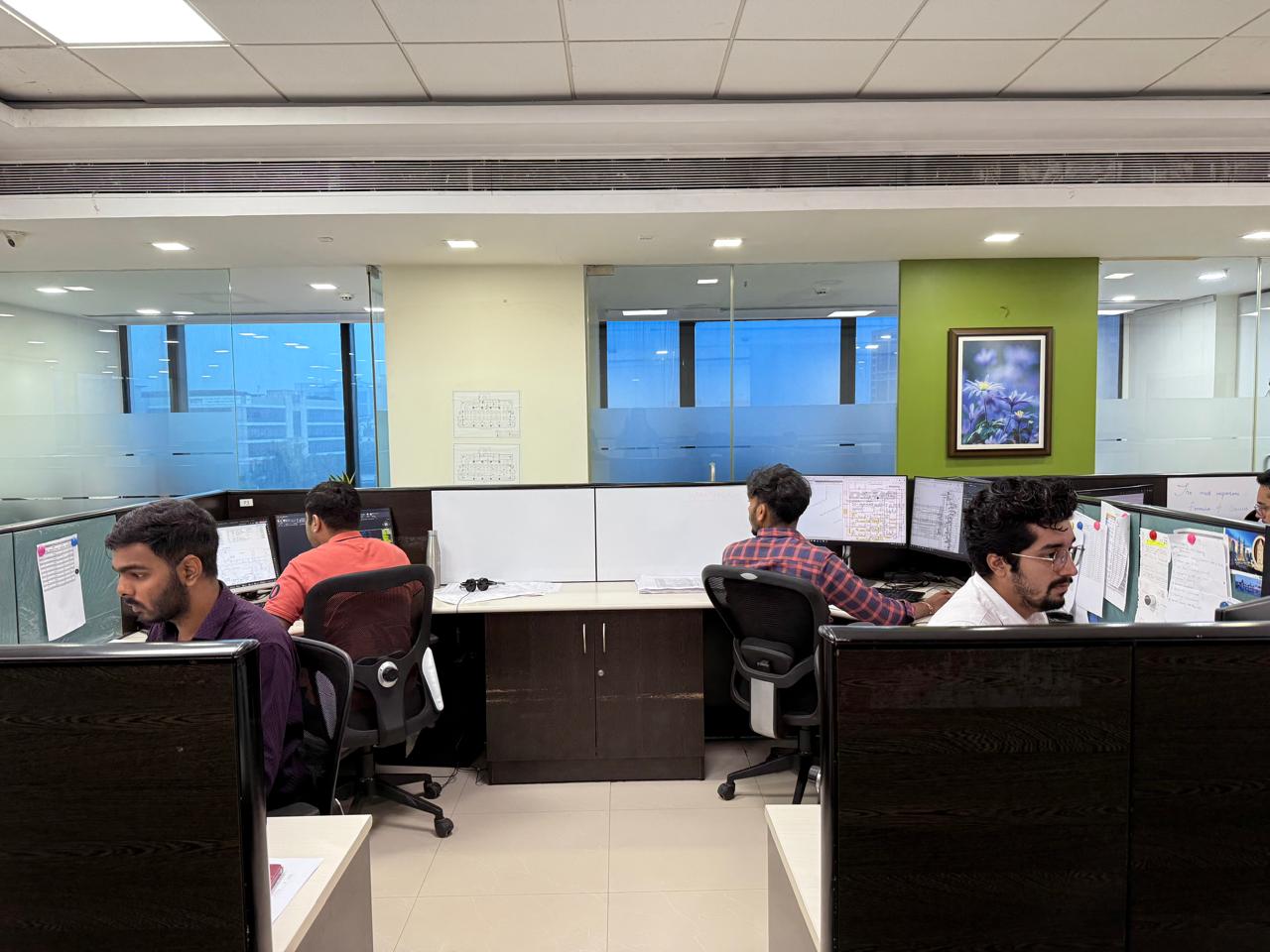 Specialists analyzing technical details in CAD environment